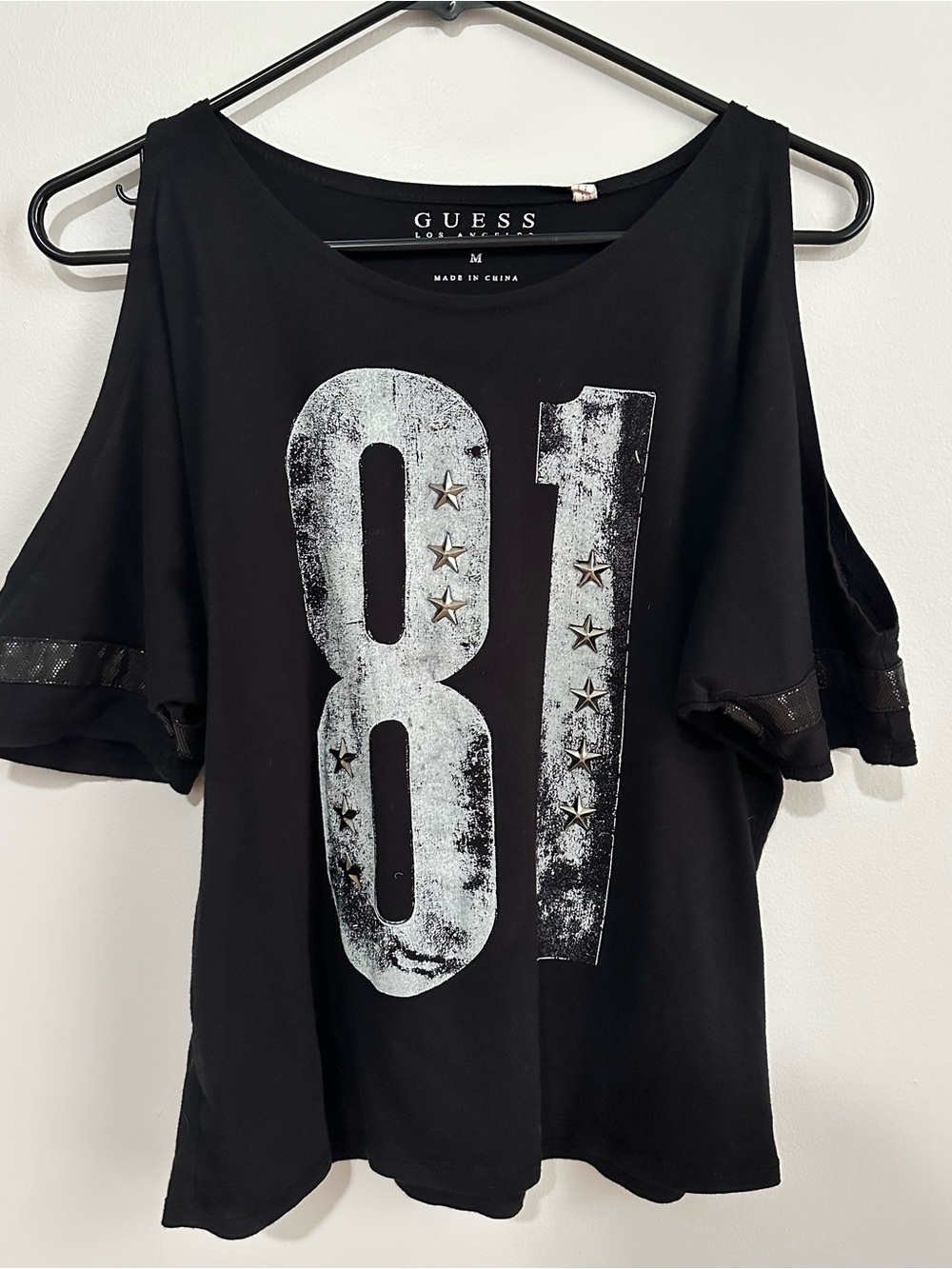 GUESS Black Cold-Shoulder Graphic Tee with '81' Stud Accents